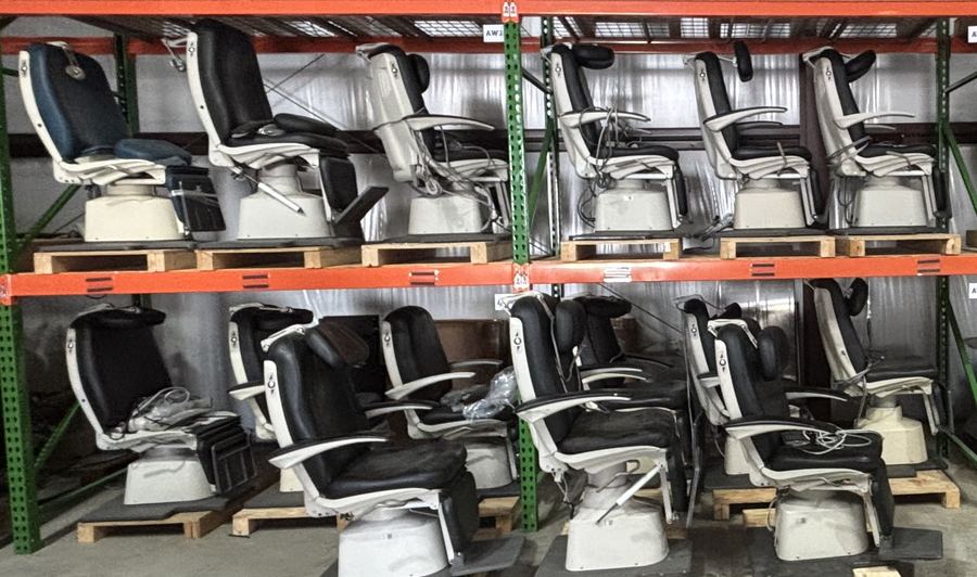 Rows of ENT and ophthalmology exam chairs on warehouse racking